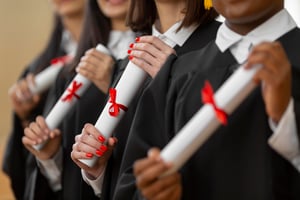 people-graduating-with-diplomas-close-up